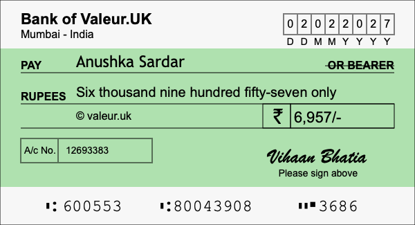 How to write a cheque for 6,957 rupees